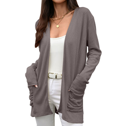 Solid color long sleeved pocket top for women