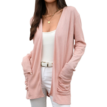 Solid color long sleeved pocket top for women