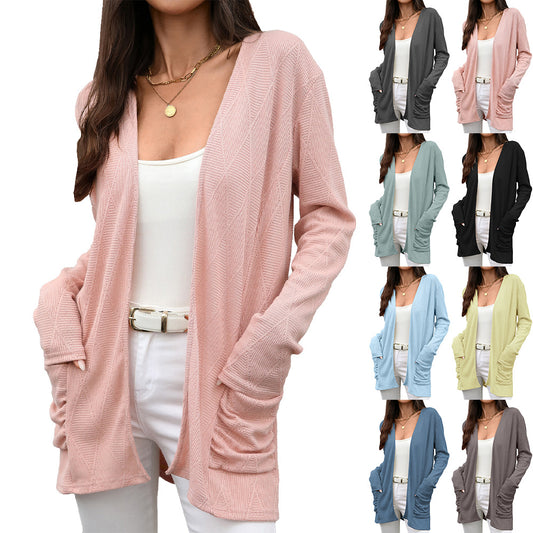 Solid color long sleeved pocket top for women