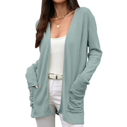 Solid color long sleeved pocket top for women